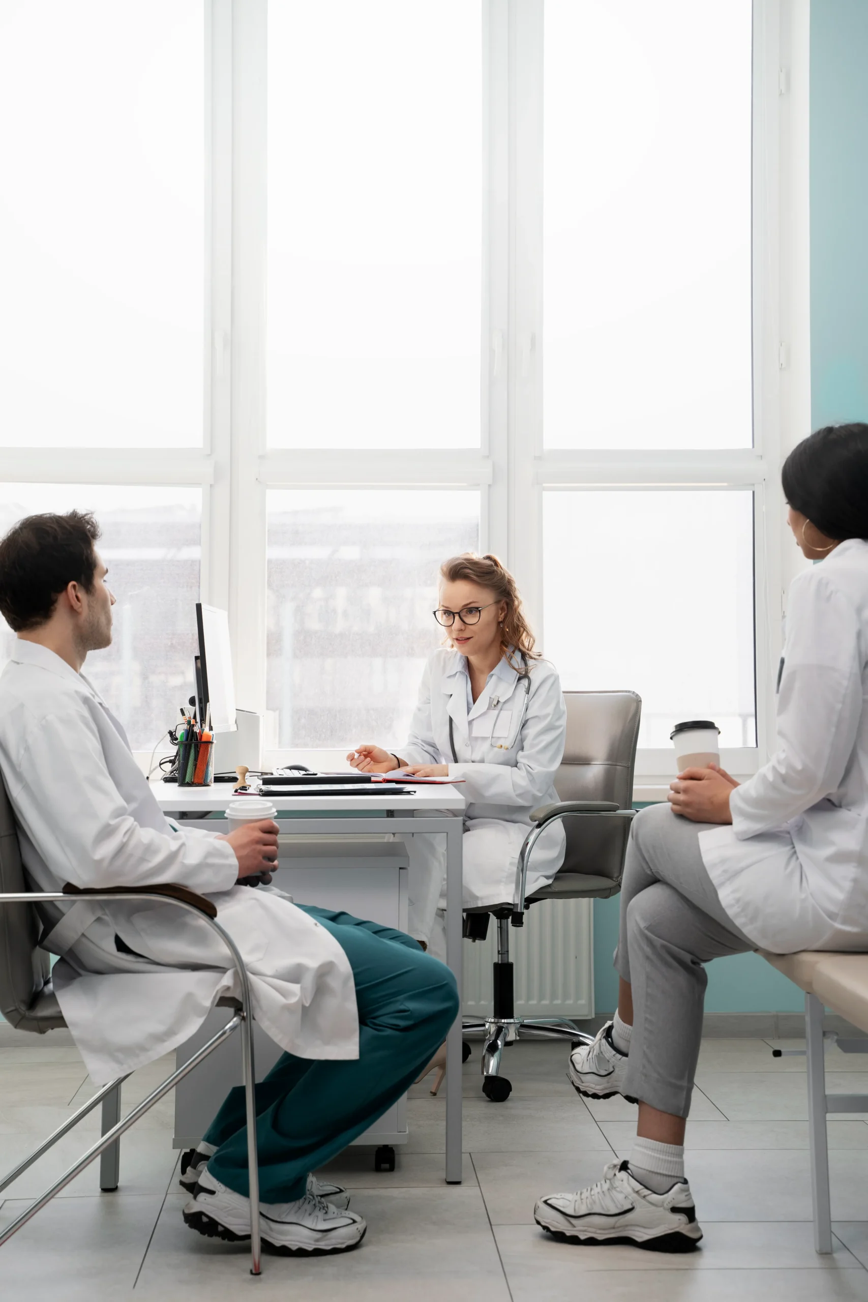 Healthcare team reviewing patient records during a consultation powered by a healthcare CRM system.