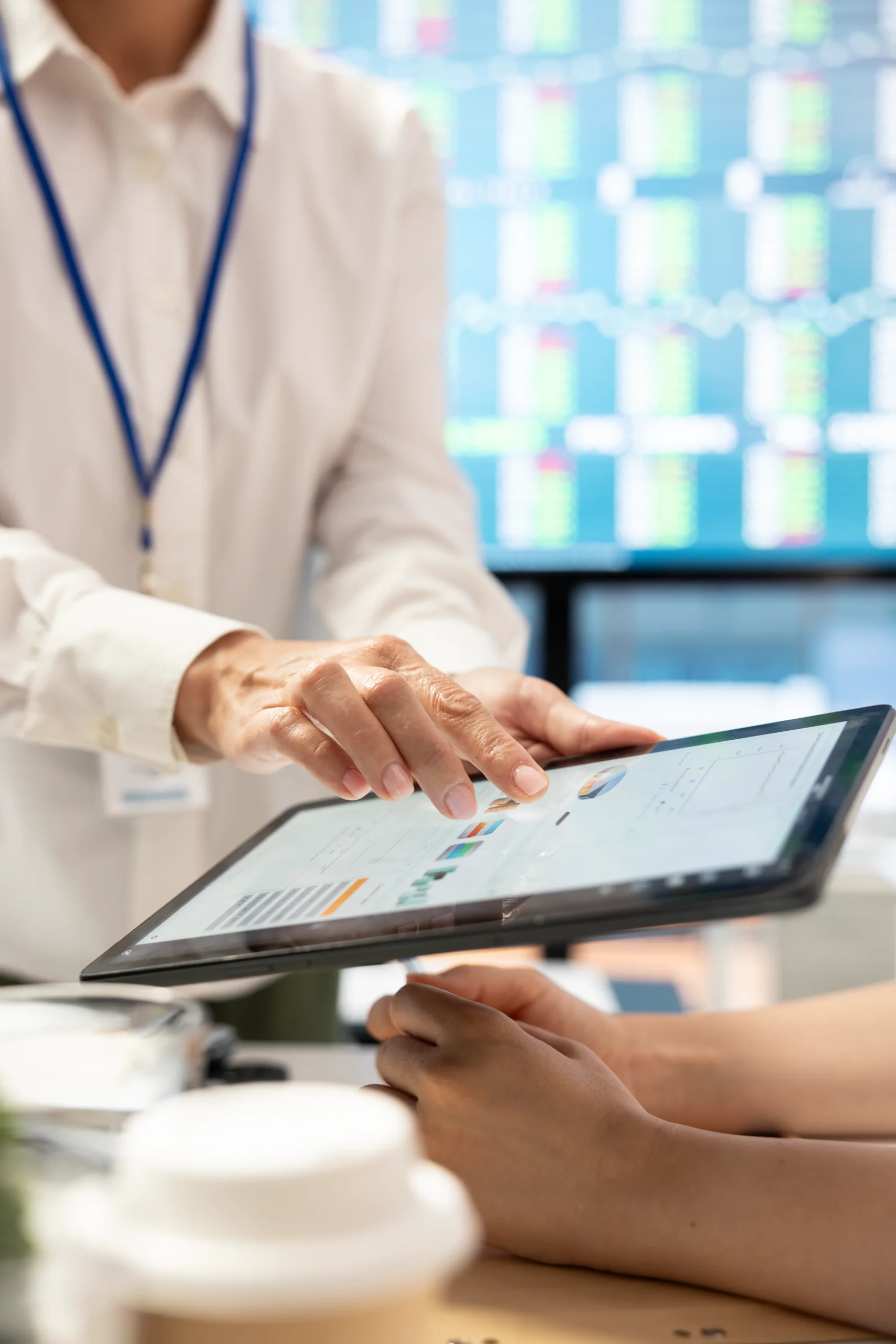 Healthcare professional using a tablet interface powered by a Medical CRM to review patient records.