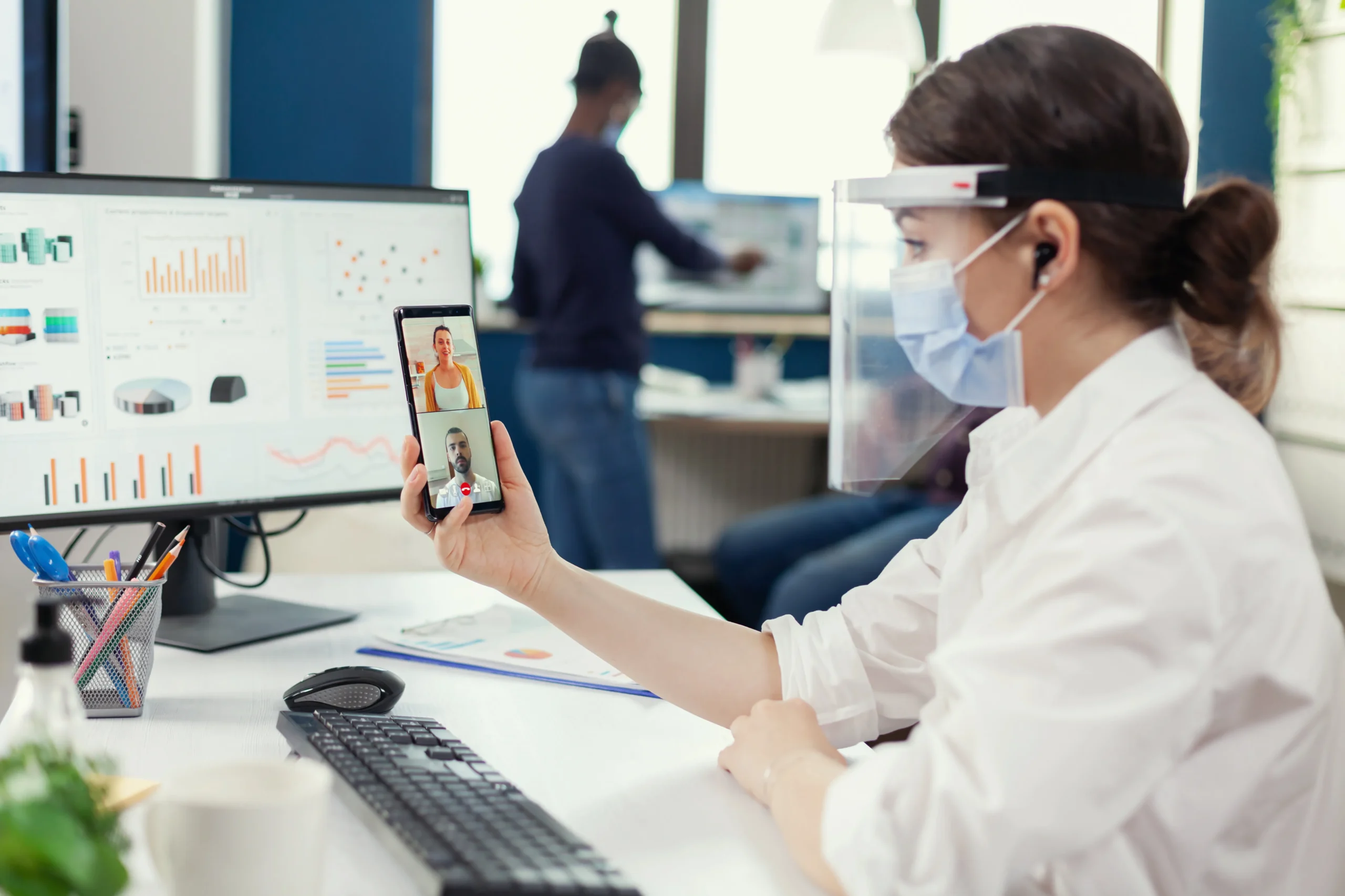 Pharmacy intake specialist conducting virtual consultations for specialty pharmacy patient onboarding.